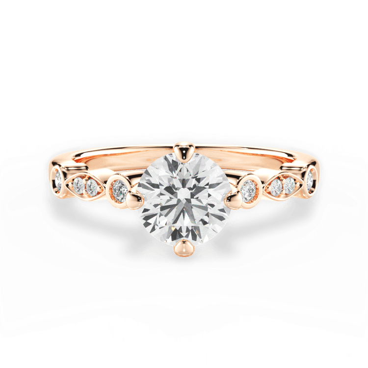 The Augusta Round Cut 18kt Rose Gold Kite-Set Diamond Sidestone Engagement Ring