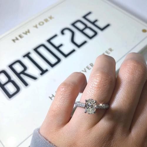 1.5 carat oval cut diamond ring on hand