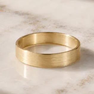 mens wedding band on marble table