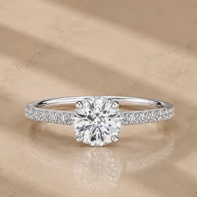 hidden halo engagement ring on neutral background