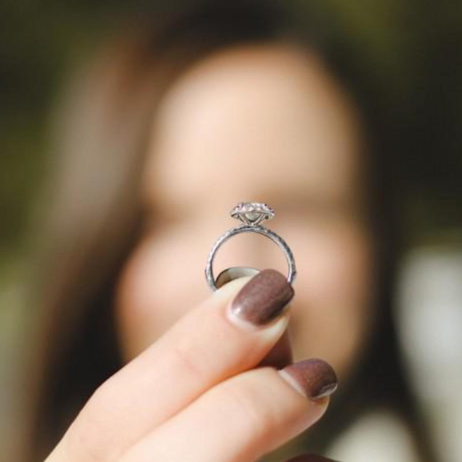 Holding an engagement ring