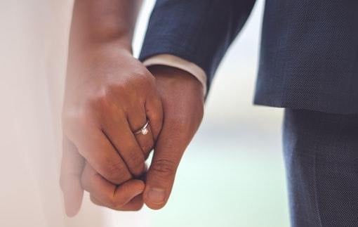 engagement ring on ring finger