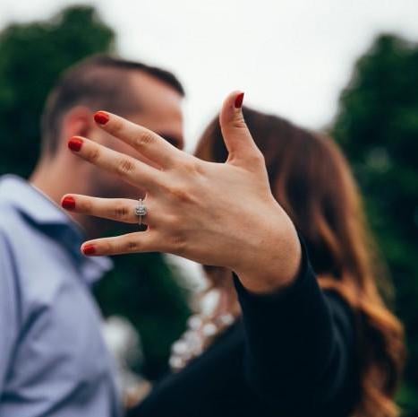 woman showing off her engagement ring